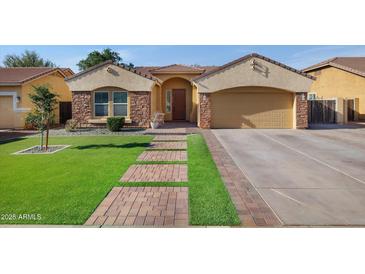 Charming single-Gathering home featuring a two-car garage, landscaped yard, and welcoming front porch at 3592 E Sandwick Dr, San Tan Valley, AZ 85140