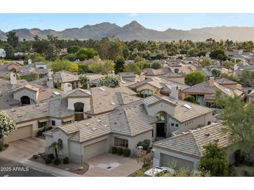 Stunning aerial view of the neighborhood showcasing tile roofs and desert landscaping with mountain backdrop at 7705 E Doubletree Ranch Rd # 51, Scottsdale, AZ 85258