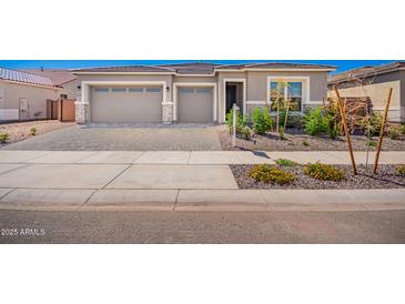 Charming single-story home featuring a two car garage and well maintained landscaping at 24152 N 172Nd Ave, Surprise, AZ 85387