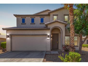 Charming two-story home with a two-car garage and beautifully landscaped front yard at 29051 N Shannon Dr, San Tan Valley, AZ 85143