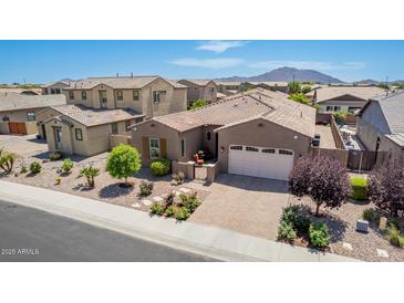 Charming single-story home featuring a tile roof, well-manicured landscaping, and a two-car garage at 3269 E Ironside Ln, Gilbert, AZ 85298
