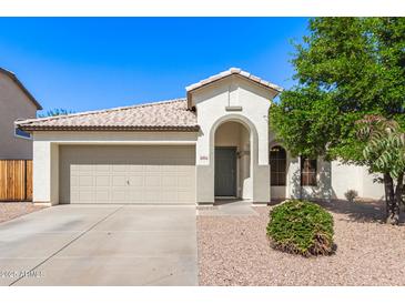 Charming single-story home featuring a neutral color palette, arched entry, and a well-manicured landscape at 3994 E Maplewood St, Gilbert, AZ 85297