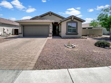 Charming single-story home with a well-maintained yard and a two-car garage in a quiet neighborhood at 3013 S 102Nd Ln, Tolleson, AZ 85353