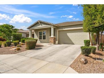 Well-maintained single-Gathering home with a two-car garage, desert landscaping, and a concrete driveway at 460 W Glacier Bay Dr, San Tan Valley, AZ 85140