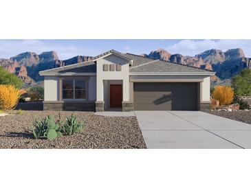 Charming single-story home features a neutral color palette, desert landscaping, and an attached two-car garage at 5824 E Axle Ln, San Tan Valley, AZ 85140