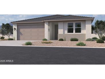 Charming single-story home featuring a two-car garage, neutral stucco siding, and low maintenance desert landscaping at 9543 W Parkway Dr, Tolleson, AZ 85353