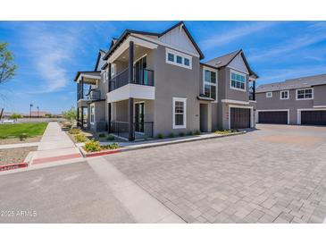 Stunning two-story home with a balcony, three-car garage and beautiful landscaping at 11300 N Casa Dega Dr # 1027, Surprise, AZ 85388