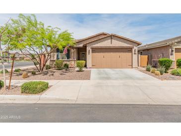Charming single-story home with a two-car garage, desert landscaping, and inviting curb appeal at 14166 W Valentine St, Surprise, AZ 85379