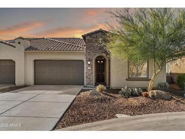 Charming single-Gathering home with well-manicured landscaping, desert accents, and a three car garage, ideal for suburban living at 16945 W Vernon Ave, Goodyear, AZ 85395