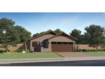 Charming single-story home with a two-car garage and low-maintenance desert landscaping at 23196 W Marguerite Ave, Buckeye, AZ 85326