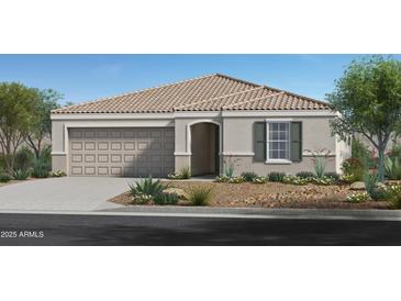 Charming single-story home featuring a two-car garage and desert landscaping at 24659 W Wayland Dr, Buckeye, AZ 85326
