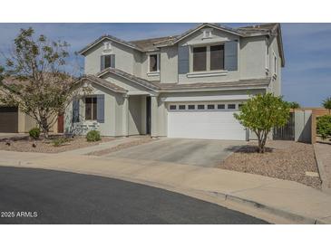 Two story home featuring a two car garage, neutral color palette, and manicured landscaping at 3247 N Loma Vis, Mesa, AZ 85213