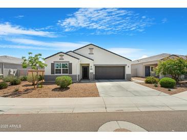 Charming single-story home with a well-manicured lawn and a two-car garage at 5237 W Alta Mesa Ave, Laveen, AZ 85339