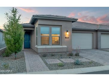 Charming single-Gathering home with manicured landscaping and a private two-car garage at 18332 E Spring Valley Ct, Rio Verde, AZ 85263