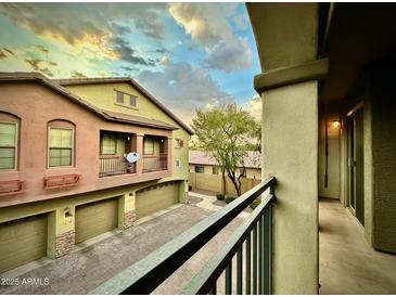 View of the property's exterior, showcasing its architecture and lovely curb appeal against a dramatic sky at 2150 E Bell Rd # 1113, Phoenix, AZ 85022