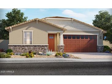Charming single-story home featuring a two-car garage, desert landscaping, and a welcoming front entrance at 24467 W Grenadine Rd, Buckeye, AZ 85326