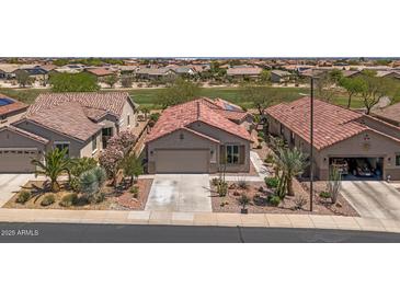 Charming home with a tile roof, desert landscaping, and a two-car garage at 301 S 225Th Ave, Buckeye, AZ 85326