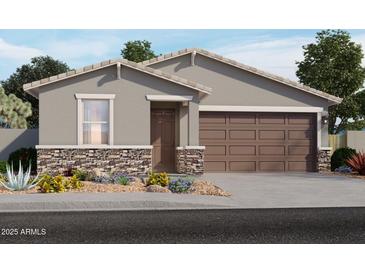 Charming single-story home featuring stone accents, a two-car garage, and desert landscaping for curb appeal at 3582 E Audrey Dr, San Tan Valley, AZ 85143