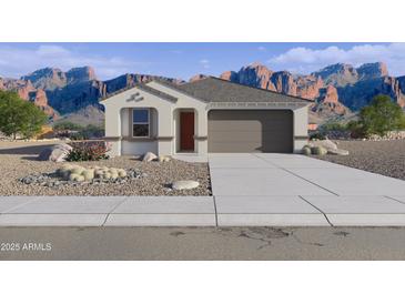 Charming single-story home with a two-car garage and desert landscaping against a beautiful mountain backdrop at 46392 W Lander Ln, Maricopa, AZ 85139