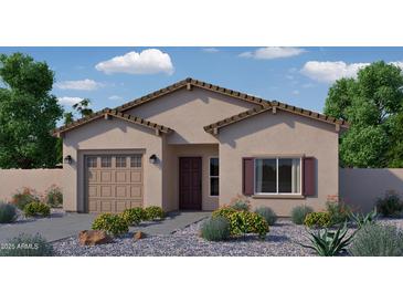Charming single-story home featuring a well-manicured front yard with desert landscaping and a two-car garage at 755 N Don Frank Ln, Wickenburg, AZ 85390