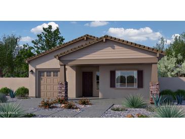Charming single-story home with desert landscaping, a two-car garage, and a welcoming front porch at 786 N Don Frank Ln, Wickenburg, AZ 85390