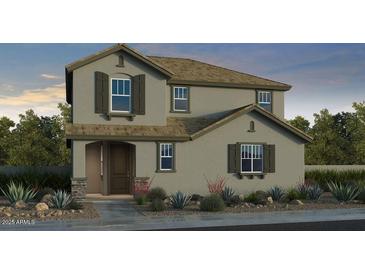 Charming two-story home with stone accents, desert landscaping, and neutral color palette at 9952 W Piccadilly Rd, Avondale, AZ 85392