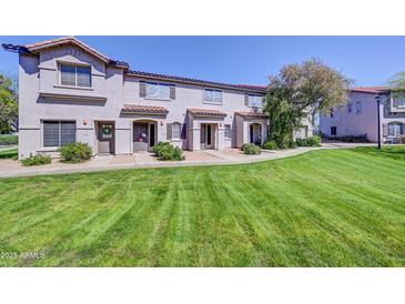 Inviting townhouse featuring a well-maintained lawn and charming architecture, perfect for comfortable living at 1961 N Hartford St # 1149, Chandler, AZ 85225