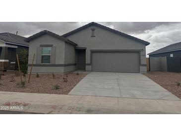 Charming single-story home featuring desert landscaping, neutral colors, and a two-car garage at 3913 E San Jose St, San Tan Valley, AZ 85143