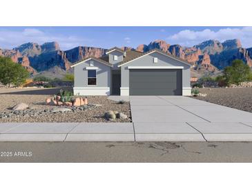 Charming single-Gathering home with desert landscaping, mountain view, and two car garage at 46431 W Lander Ln, Maricopa, AZ 85139