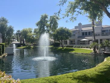 Beautiful water feature with fountain set in a lush landscaped garden in front of this lovely property at 7272 E Gainey Ranch Rd # 121, Scottsdale, AZ 85258