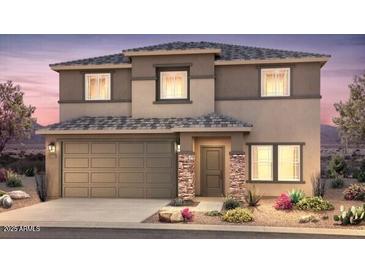 Inviting two-story home featuring a two-car garage and desert landscaping at 2428 S 246Th Ln, Buckeye, AZ 85326