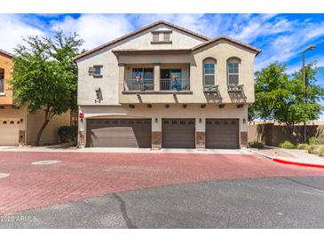 Beautiful three-story townhome featuring a charming balcony and three-car garage at 2727 N Price Rd # 3, Chandler, AZ 85224