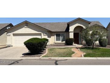 Charming single-story home with a well-maintained front yard and attached garage at 3700 E Sandwick Dr, San Tan Valley, AZ 85140