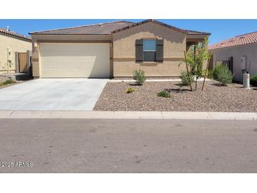 Charming single-story home with a well-maintained yard and attached two-car garage in a residential neighborhood at 48171 N La Soledad --, Gold Canyon, AZ 85118