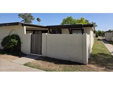 Cozy home featuring a private courtyard with block wall and gated entry, perfect for outdoor enjoyment at 720 S Dobson Rd # 24, Mesa, AZ 85202