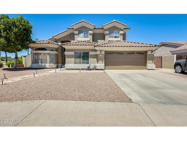 Two-story home with tile roof, desert landscaping, and a two-car garage at 1266 S Harrington St, Gilbert, AZ 85233