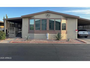 Charming single-story home with well-maintained landscaping and covered parking at 11596 W Sierra Dawn Blvd # 209, Surprise, AZ 85378