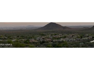 Panoramic view of a desert mountain range with houses below at 15025 E Scarlet Sky Ln # 1, Fountain Hills, AZ 85268
