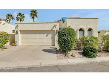 Charming home with a two-car garage and desert landscaping at 4618 E Valley View Dr, Phoenix, AZ 85044