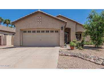 Charming single-story home featuring a two-car garage and well-maintained landscaping, promoting curb appeal at 829 S Roanoke St, Gilbert, AZ 85296