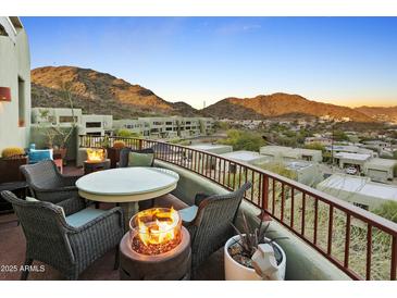Inviting outdoor seating area with mountain views and cozy fire pits at 10005 N 1St Dr, Phoenix, AZ 85021