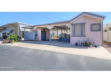 Charming single-Gathering home with covered parking, a beautiful lawn, and desert landscaping at 17200 W Bell Rd # 840, Surprise, AZ 85374