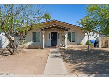 Charming single-story home with a covered porch and desert landscaping, perfect for curb appeal at 2306 W Laurel Ln, Phoenix, AZ 85029