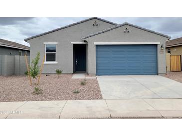 Charming single story home with a blue garage door and low maintenance desert landscaping at 3598 E Audrey Dr, San Tan Valley, AZ 85143