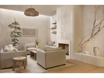 Inviting living room with neutral tones, comfortable seating, and a unique fireplace design at 5101 N Casa Blanca Dr # 223, Paradise Valley, AZ 85253