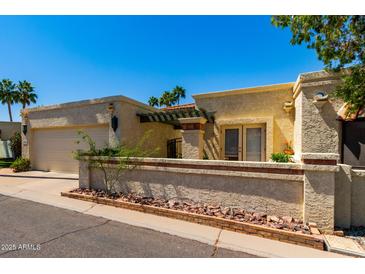 Charming single-story home with a landscaped front yard and inviting curb appeal at 9012 S 47Th Pl, Phoenix, AZ 85044