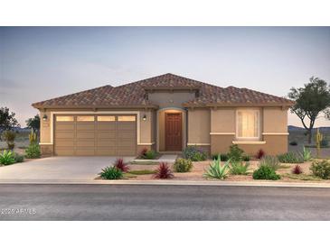 Charming single-story home featuring a tile roof, a two-car garage, and desert landscaping at 6996 W Hedge Hog Pl, Peoria, AZ 85383
