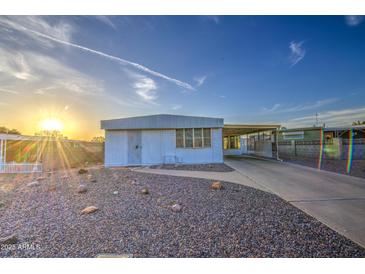 Charming single-story home with desert landscaping and covered parking at 7318 E Arbor Ave, Mesa, AZ 85208