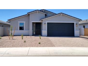 Charming single-Gathering home with a two-car garage and low maintenance desert landscaping at 4347 W Hannah St, San Tan Valley, AZ 85144