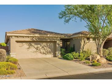 Charming home with a two-car garage, landscaped yard, and inviting curb appeal at 41814 N Crooked Stick Rd, Anthem, AZ 85086